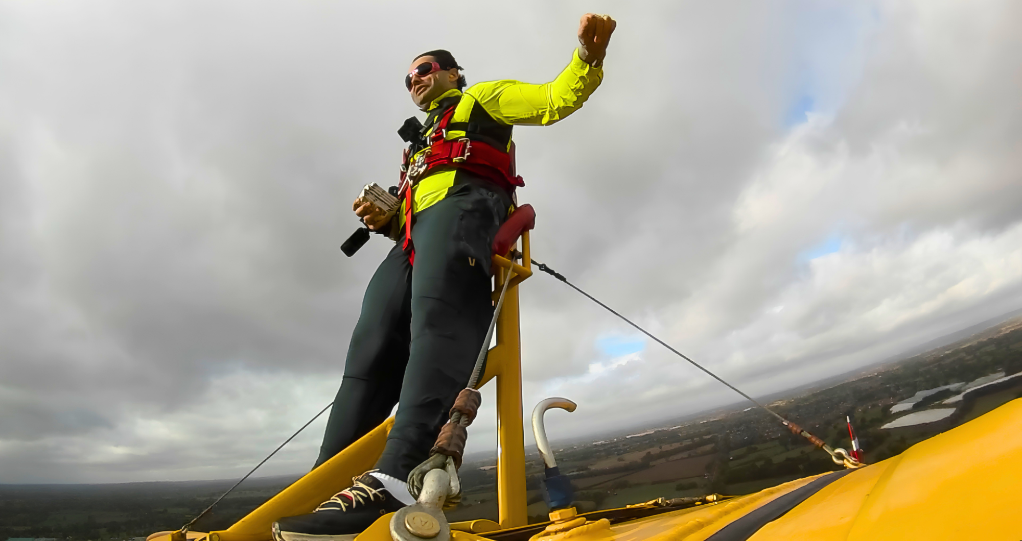 Daredevil collector sets bizarre Guinness World Record by ripping open trading cards while strapped to wing of flying plane